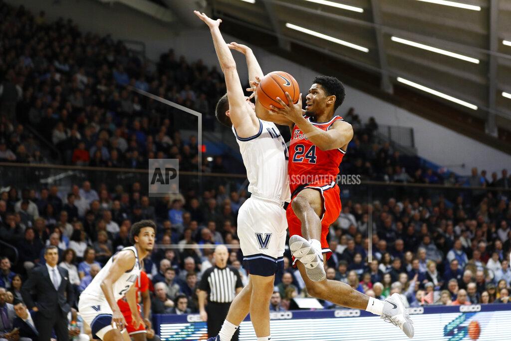 Matt Slocum St. John's Nick Rutherford (24) goes up for a shot against Villanova's Collin Gillespie (2) during the first half of an NCAA college basketball game, Wednesday, Feb. 26, 2020, in Villanova, Pa. (AP Photo/Matt Slocum)