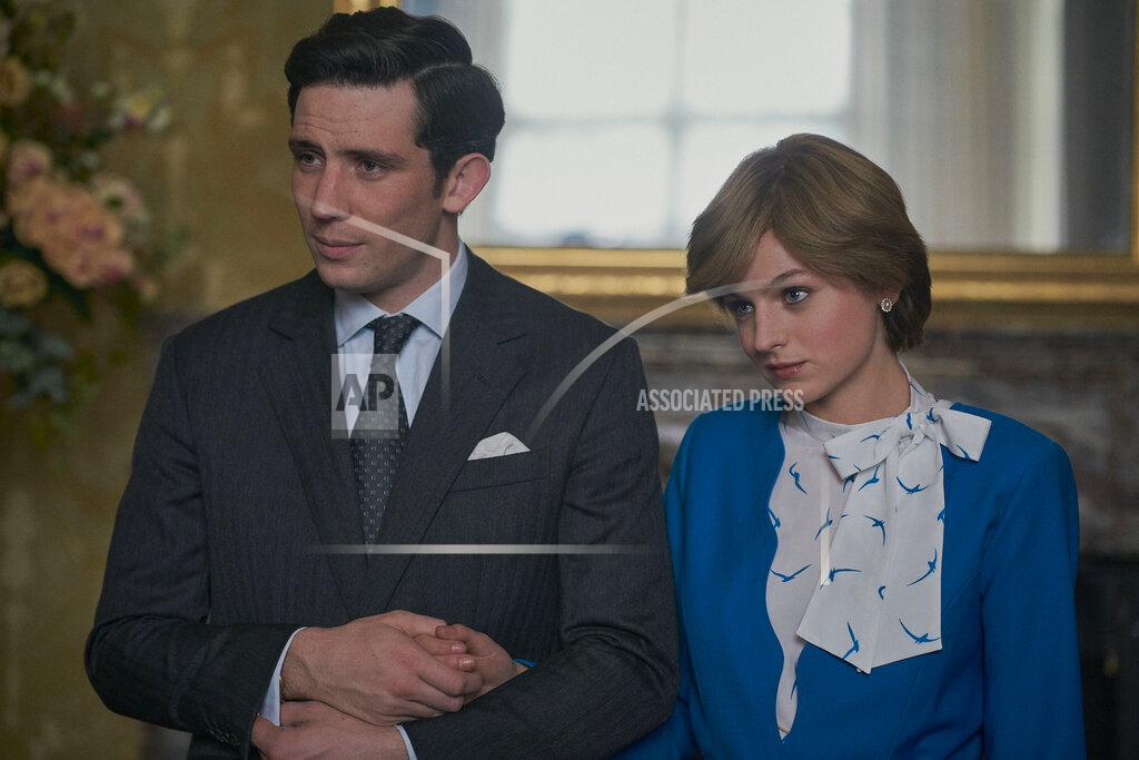Des Willie This image released by Netflix shows Josh O'Connor, left, and Emma Corrin in a scene from "The Crown." O'Connor and Corrin are considered frontrunners for Emmy awards for lead actor and actress in a drama series for their portrayals of ill-fated royal mates Charles and Diana. (Des Willie/Netflix via AP)