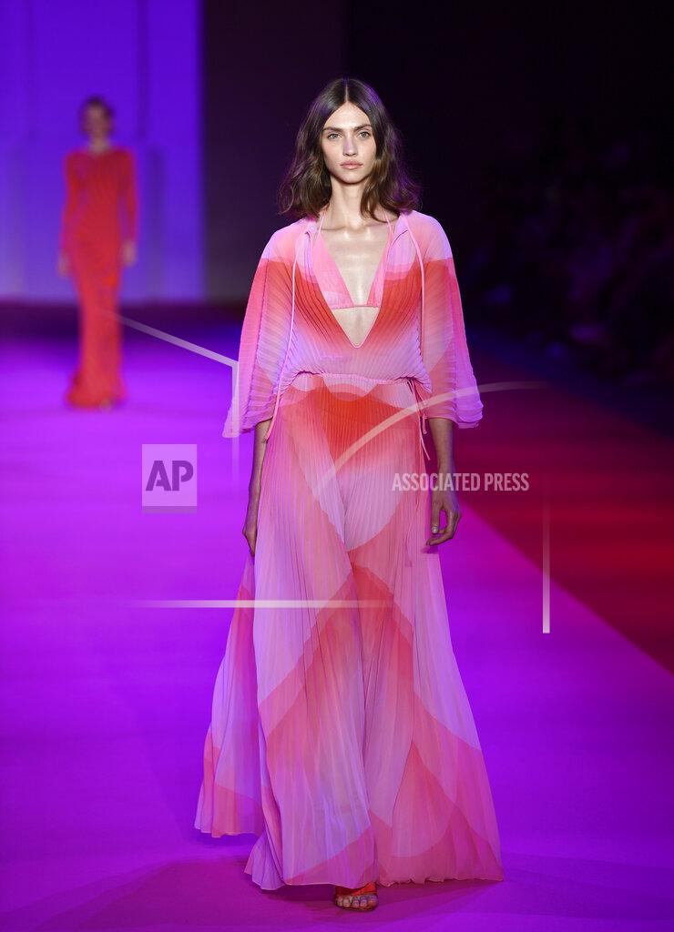 Evan Agostini A model walks the runway at the Brandon Maxwell spring/summer 2022 fashion show in the Brooklyn borough of New York during Fashion Week on Friday, Sept. 10, 2021. (Photo by Evan Agostini/Invision/AP)