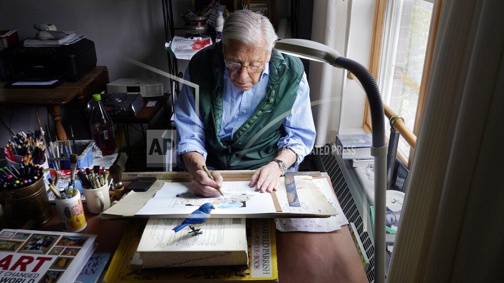 Charles Krupa Artist Robert Seaman works on his 365th daily doodle in his room at an assisted living facility Monday, May 10, 2021, in Westmoreland, N.H. Seaman, who moved into the facility weeks before the COVID-19 pandemic shutdown his outside world in 2020, recently completed his 365th daily sketch, or what he calls his "Covid Doodles", since being isolated due to the virus outbreak. (AP Photo/Charles Krupa)