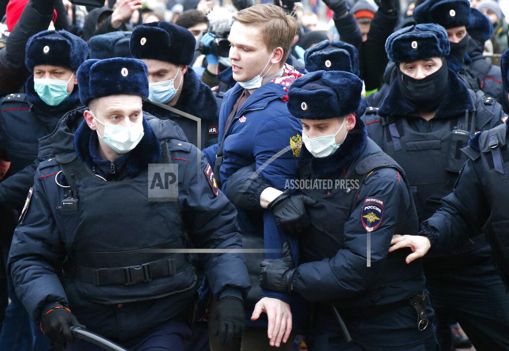 Alexander Zemlianichenko Police detain a man during a protest against the jailing of opposition leader Alexei Navalny in Moscow, Russia, Saturday, Jan. 23, 2021. Russian police are arresting protesters demanding the release of the top Russian opposition leader at demonstrations (AP Photo/Alexander Zemlianichenko)