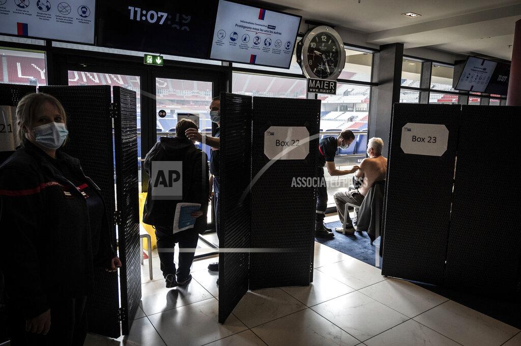 Jean-Philippe Ksiazek Patients receive an injection of the Moderna Covid-19 vaccine on the opening day of a mass vaccination centre set up in the Olympique Lyonnais soccer Stadium, in Decines-Charpieu, Saturday, April 3, 2021. (Jean-Philippe Ksiazek, Pool via AP)