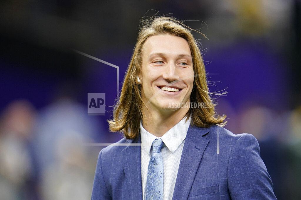 David J. Phillip Clemson quarterback Trevor Lawrence arrives before a NCAA College Football Playoff national championship game against LSU Monday, Jan. 13, 2020, in New Orleans. (AP Photo/David J. Phillip)