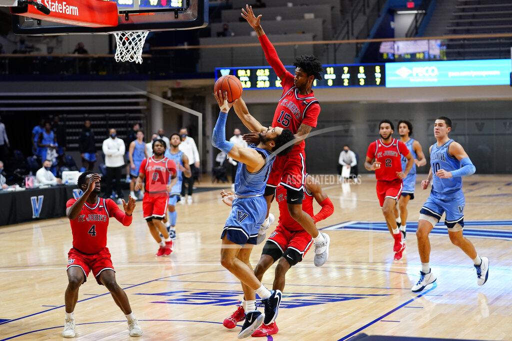 Matt Slocum Villanova's Caleb Daniels (14) tries to get a shot past St. John's Vince Cole (15) during the first half of an NCAA college basketball game, Tuesday, Feb. 23, 2021, in Villanova, Pa. (AP Photo/Matt Slocum)