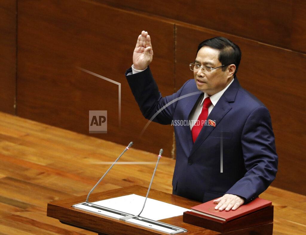 Nguyen Van Diep Vietnamese newly elected Prime Minister Pham Minh Chinh takes an oath in front of the National Assembly in Hanoi, Vietnam on Monday, April 5, 2021. Vietnam's legislature voted Monday to make Pham Minh Chinh, a member of the Communist party's central committee for personnel and organization, the country's next prime minister. Outgoing Prime Minister Nguyen Xuan Phuc was appointed the new president. (Nguyen Van Diep/VNA via AP)