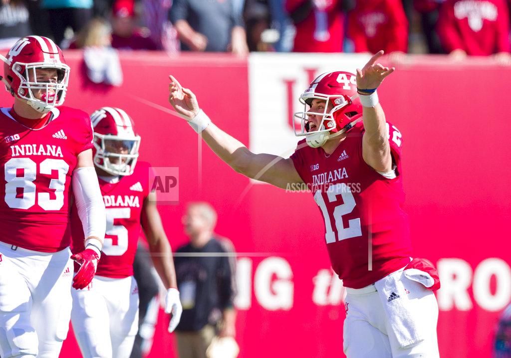 Doug Mcschooler Indiana quarterback Peyton Ramsey (12) rushes back to the line-of-scrimmage after scoring a touchdown to run a two-point conversion play in the second half of an NCAA college football game against Iowa, Saturday, Oct. 13, 2018, in Bloomington, Ind. Iowa won 42-16. (AP Photo/Doug McSchooler)