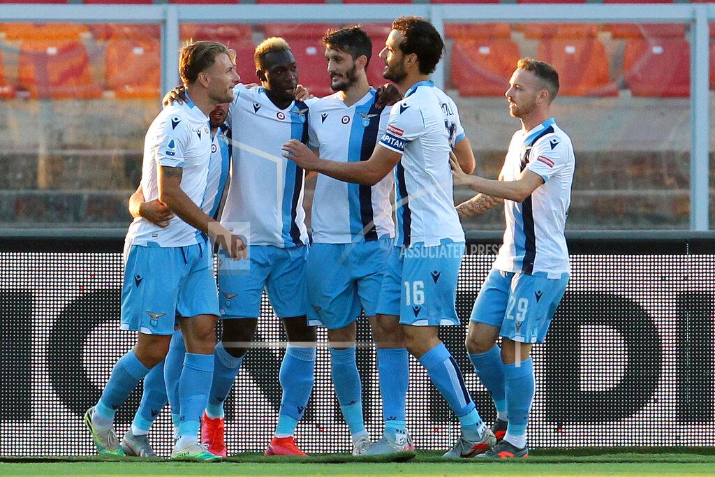 Donato Fasano Lazio's Caicedo, 3rd from left, celebrates with teammates after scoring his side's opening goal during the Serie A soccer match between Lecce and Lazio at the Stadio del Mare in Lecce, Italy, Tuesday, July 7, 2020. (Donato Fasano/LaPresse via AP)