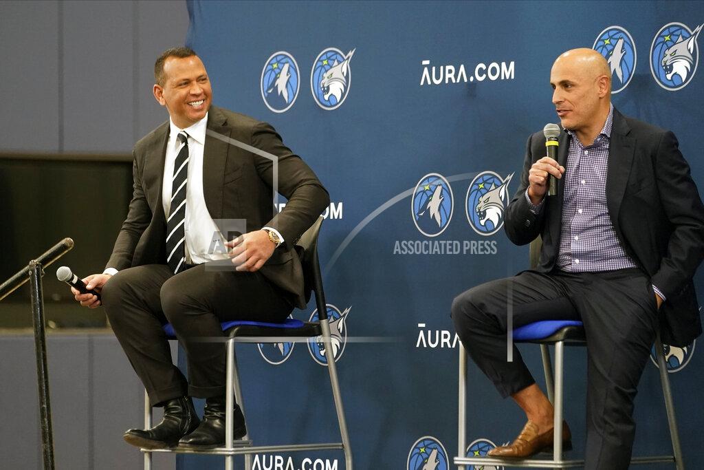 Jim Mone Minnesota Timberwolves new owners Marc Lore, right, and baseball great Alex Rodriguez, left, address the media after current owner Glen Taylor introduced them during a news conference for the NBA Timberwolves basketball team, Monday, Sept. 27, 2021, in Minneapolis. (AP Photo/Jim Mone)