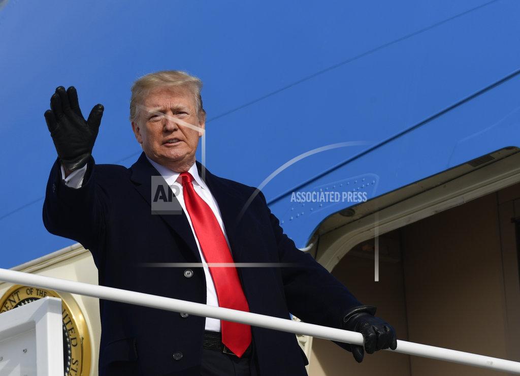 Susan Walsh President Donald Trump waves from the top of the steps of Air Force One at Andrews Air Force Base in Md., Saturday, Dec. 8, 2018. Trump is heading to the Army-Navy football game in Philadelphia. (AP Photo/Susan Walsh)