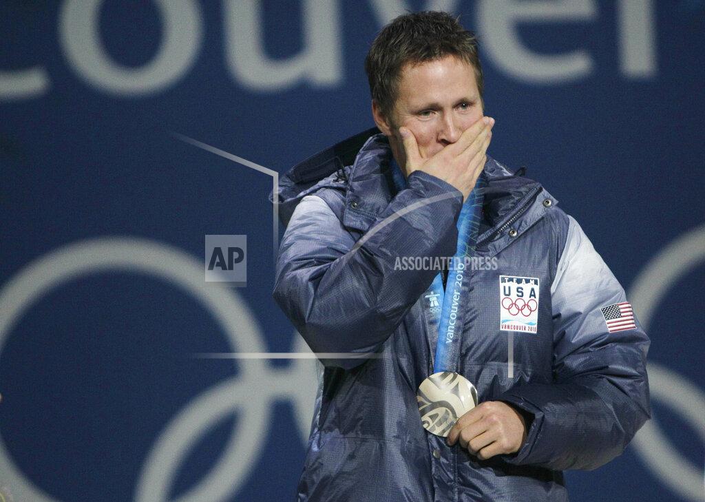 Gerry Broome FILE - USA's silver medal winner Jeret Peterson reacts during the medals ceremony for the men's freestyle skiing aerials at the 2010 Winter Olympics in Vancouver, British Columbia on Feb. 26, 2010. Peterson took his own life at the age of 29 in 2011 just a year and a half after winning the medal. Olympians including Michael Phelps, Apolo Ohno and Jeremy Bloom are opening up about their mental health struggles in a new sobering documentary about suicide and depression among the world's greatest athletes. Many of the athletes are sharing their pain for the first time in HBO's "The Weight of Gold," which aims to expose the problem, incite change among Olympics leadership and help others experiencing similar issues feel less alone. (AP Photo/Gerry Broome)