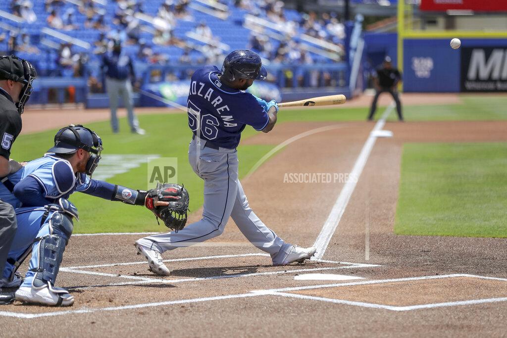Mike Carlson Tampa Bay Rays' Randy Arozarena (56) doubles in front of Toronto Blue Jays catcher Danny Jansen during the first inning of a baseball game Sunday, May 23, 2021, in Dunedin, Fla. (AP Photo/Mike Carlson)