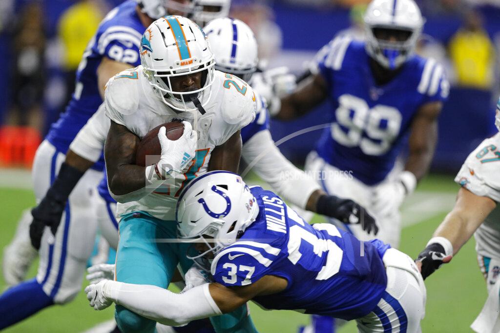 Darron Cummings Miami Dolphins running back Kalen Ballage (27) is tackled by Indianapolis Colts safety Khari Willis (37) during the second half of an NFL football game in Indianapolis, Sunday, Nov. 10, 2019. (AP Photo/Darron Cummings)