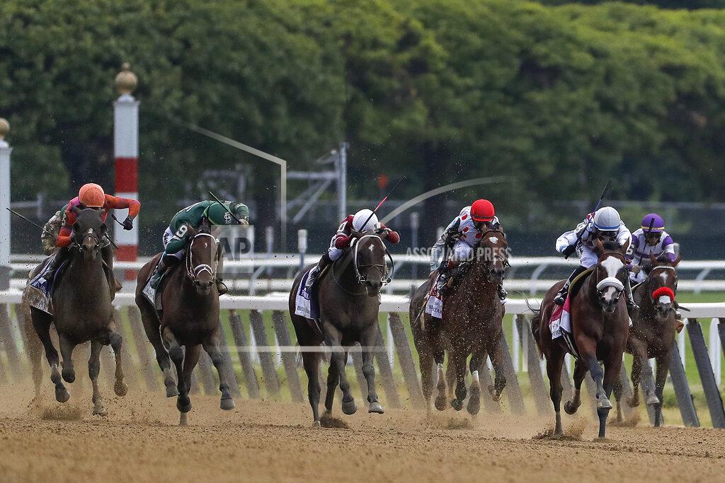 Seth Wenig Tiz the Law (8), with jockey Manny Franco up, second from right, leads the pack down the home stretch during the152nd running of the Belmont Stakes horse race, Saturday, June 20, 2020, in Elmont, N.Y. Tiz the Law won the race. (AP Photo/Seth Wenig)