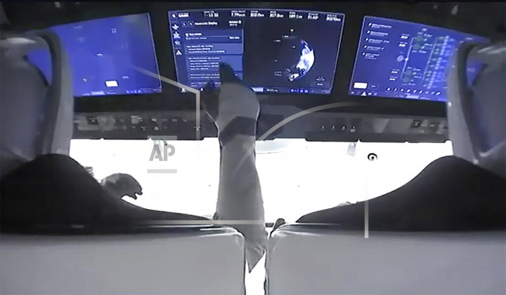 Uncredited In this image made from NASA video, astronauts are seen in the cockpit of the SpaceX Crew Dragon spacecraft after lift off for the Crew-2 mission from Launch Complex 39A, Friday, April 23, 2021, at the Kennedy Space Center in Cape Canaveral, Fla. (NASA via AP)