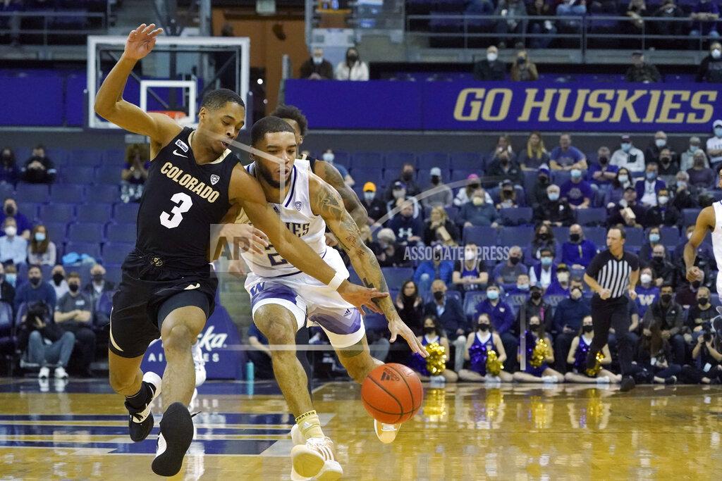 Ted S. Warren Colorado guard Keeshawn Barthelemy (3), tries to stop a drive by Washington guard Terrell Brown Jr., right, during the first half of an NCAA college basketball game, Thursday, Jan. 27, 2022, in Seattle. (AP Photo/Ted S. Warren)
