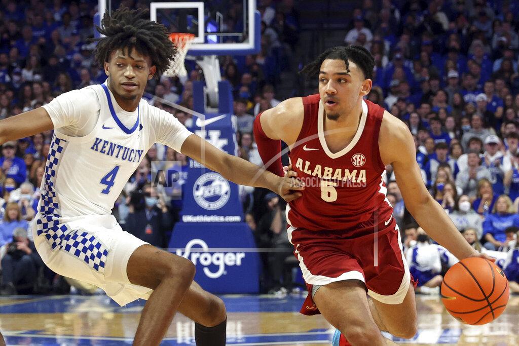 James Crisp Alabama's Jaden Shackelford (5) drives near Kentucky's Daimion Collins (4) during the second half of an NCAA college basketball game in Lexington, Ky., Saturday, Feb. 19, 2022. Kentucky won 90-81. (AP Photo/James Crisp)