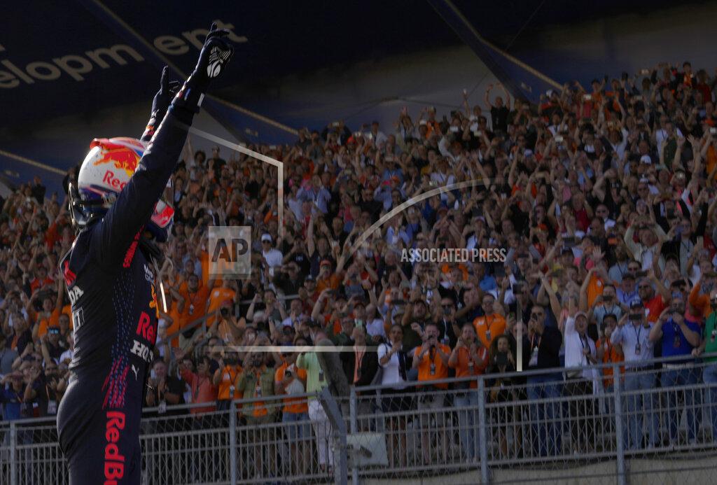 Francisco Seco Red Bull driver Max Verstappen of the Netherlands celebrates after winning the Formula One Dutch Grand Prix, at the Zandvoort racetrack, Netherlands, Sunday, Sept. 5, 2021. (AP Photo/Francisco Seco)