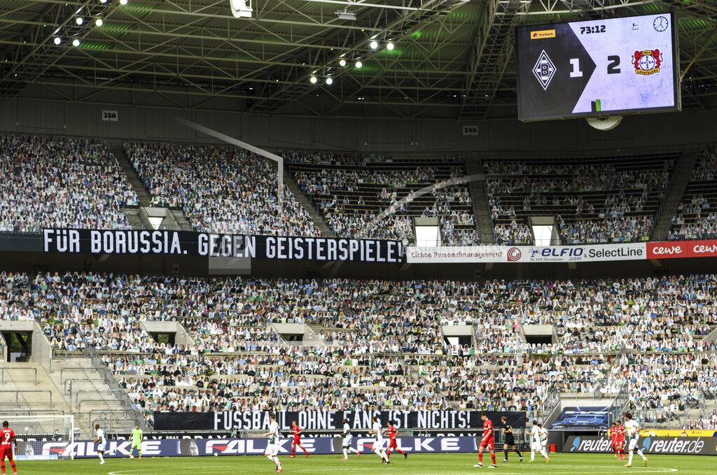 Ina Fassbender A banner reading "For Borussia, against ghost matches" is displayed during the German Bundesliga soccer match between Borussia Moenchengladbach and Leverkusen, in Moenchengladbach, Germany, Saturday, May 23, 2020. (Ina Fassbender Pool Photo via AP)