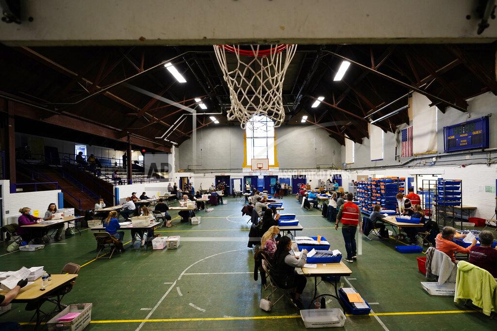 Matt Slocum Chester County, Pa., election workers check mail-in and absentee ballots for the 2020 General Election in the United States at West Chester University, Tuesday, Nov. 3, 2020, in West Chester, Pa. (AP Photo/Matt Slocum)