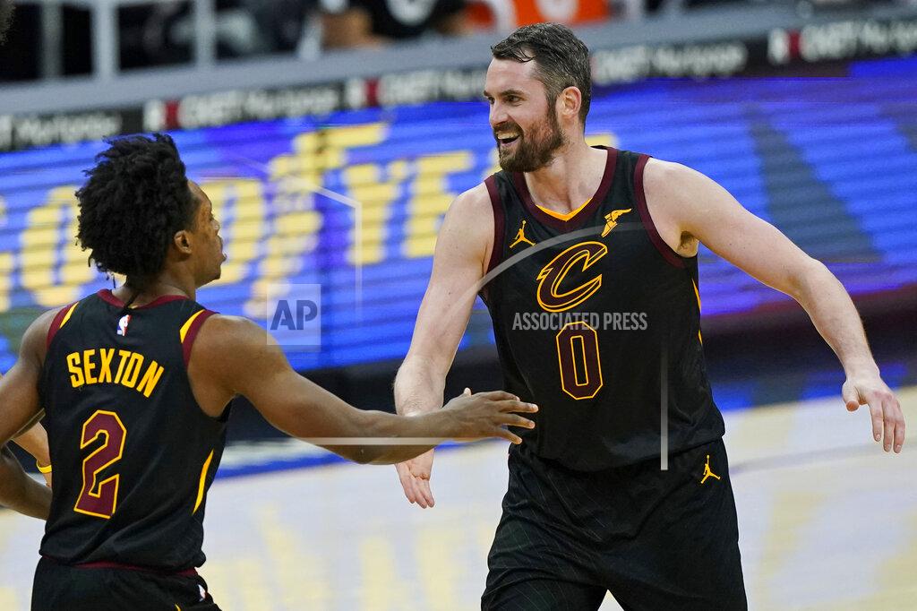 Tony Dejak Cleveland Cavaliers' Kevin Love, right, celebrates with Collin Sexton after Sexton scored during the second half of the team's NBA basketball game against the Boston Celtics, Wednesday, May 12, 2021, in Cleveland. The Cavaliers won 102-94. (AP Photo/Tony Dejak)