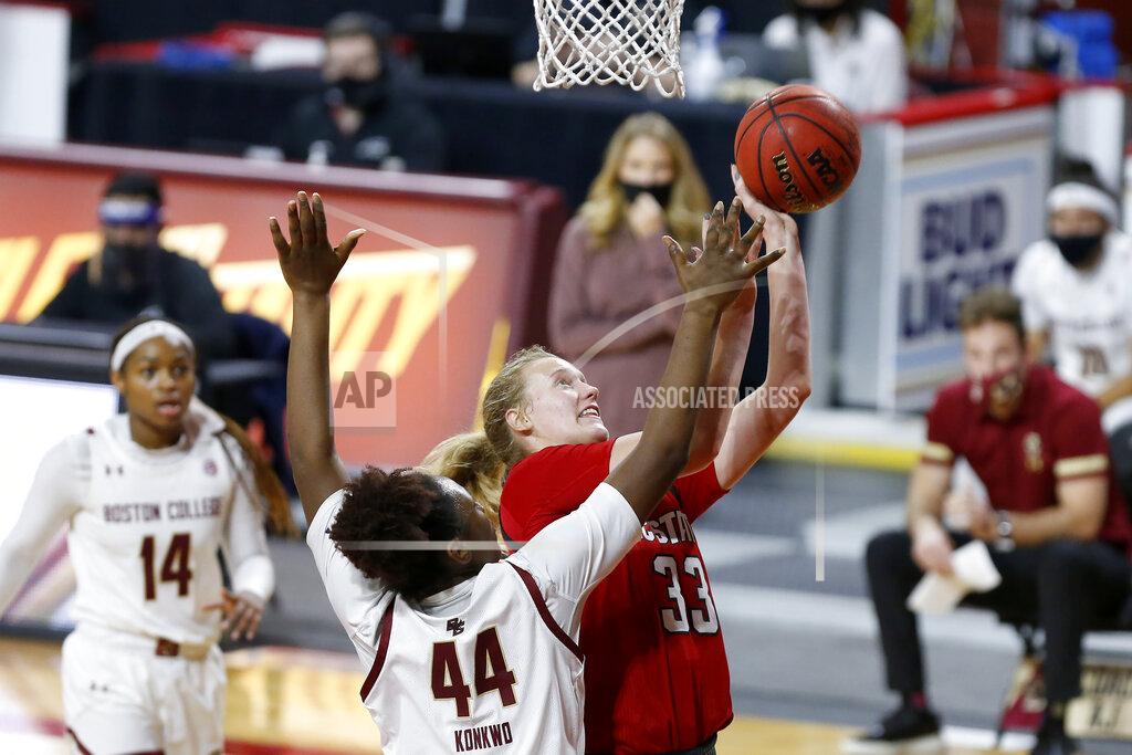 Mary Schwalm NC State's Elissa Cunane (33) drives to the basket against Boston College's Akunna Konkwo (44) during the first half of an NCAA college basketball game, Sunday, Dec. 13, 2020, in Boston. (AP Photo/Mary Schwalm)