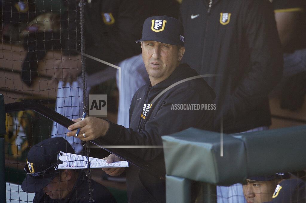 Jeff Chiu FILE - In this April 9, 2019, file photo, San Francisco head coach Nino Giarratano watches action against Stanford during an NCAA college baseball game in San Francisco. As thousands of college athletes and coaches across the country try to adjust after the sudden suspensions of entire seasons of competition and perhaps more so the camaraderie of daily practices, training sessions and team meals, communication specialists and mental health professionals are encouraging those involved to allow these young men and women to go through the stages of grieving as needed. "It is very similar to grieving," said Giarratano. "We are in contact daily trying to help them academically, athletically and keeping their spirits up." (AP Photo/Jeff Chiu, File)
