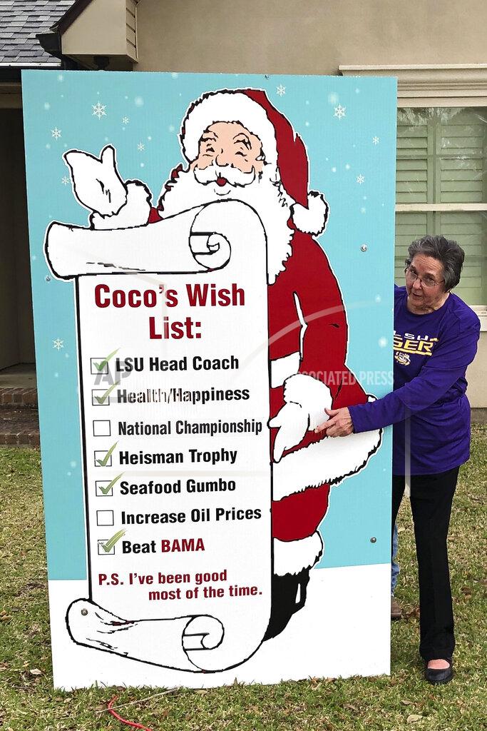Brett Martel Coco Orgeron, mother of LSU NCAA college football coach Ed Orgeron, points at a sign in the front yard of her home in Larose, La., Thursday, Jan. 9, 2020. Cajun pride is swelling in Lafourche Parish now that the former two-way football standout who won a 1977 state title for the South Lafourche High School Tarpons is on the brink of capping off arguably the LSU Tigers' greatest season in the program's 126-year history with a national title. No. 1 LSU plays third-ranked Clemson on Monday night in the College Football Playoff championship in New Orleans, about 60 miles northeast of where Orgeron grew up. (AP Photo/Brett Martel)