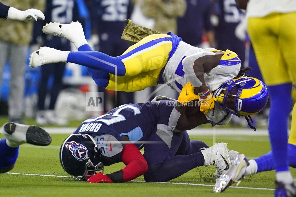 Marcio Jose Sanchez Los Angeles Rams running back Darrell Henderson, above, is brought down by Tennessee Titans inside linebacker Jayon Brown, below, during the first half of an NFL football game Sunday, Nov. 7, 2021, in Inglewood, Calif. (AP Photo/Marcio Jose Sanchez)
