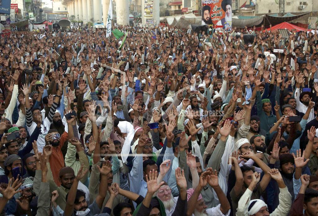 K.M. Chaudary Supporters of Tehreek-e-Labaik Pakistan, a radical Islamist political party, chant religious slogans during a sit-in protest demanding release of their leader, in Lahore, Pakistan, Thursday, Oct. 21, 2021. Thousands of Islamists are protesting in the eastern city of Lahore, demanding the release of their leader Saad Rizvi, who was arrested in April amid protest against France over depictions of Islam's Prophet Muhammad. (AP Photo/K.M. Chaudary)
