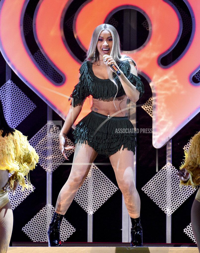 Evan Agostini FILE - In this Dec. 7, 2018 file photo, hip-hop recording artist Cardi B performs at Z100's iHeartRadio Jingle Ball at Madison Square Garden in New York. Cardi B says she received an offer to perform at the Super Bowl, but struggled with the decision to turn down the lucrative opportunity in support of ex-NFL player Colin Kaepernick. The Grammy-nominated rapper told The Associated Press on Friday, Feb. 1, 2019, that she had "mixed feelings" after she declined to take the stage at Super Bowl 53 in Atlanta. (Photo by Evan Agostini/Invision/AP, File)