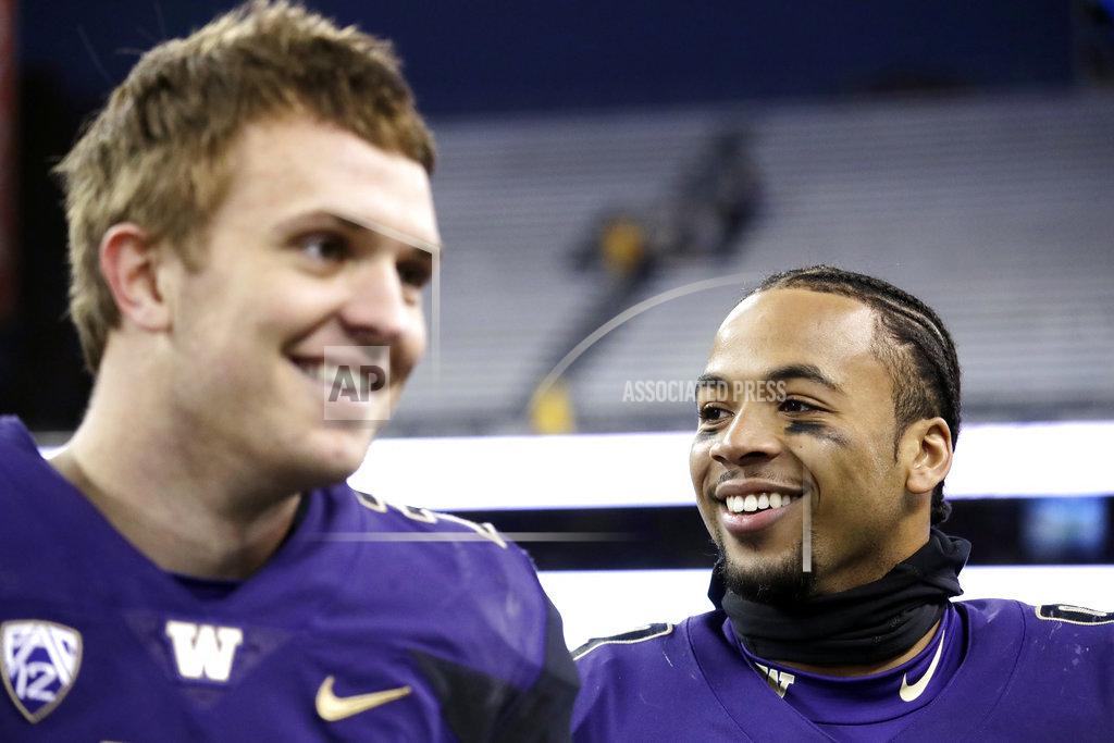 Elaine Thompson Washington quarterback Jake Browning, left, and tailback Myles Gaskin smile after being interviewed following an NCAA college football game against Oregon State, Saturday, Nov. 17, 2018, in Seattle. (AP Photo/Elaine Thompson)