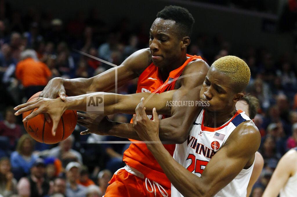 Steve Helber Syracuse forward Bourama Sidibe (34) and Virginia forward Mamadi Diakite (25) battle for a rebound during the first half of an NCAA college basketball game in Charlottesville, Va., Saturday, Jan. 11, 2020. (AP Photo/Steve Helber)