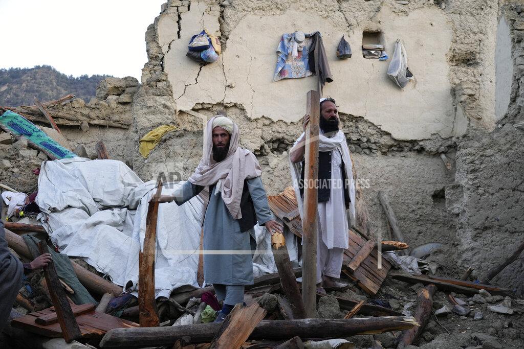 Ebrahim Noroozi Afghans stand among destruction after an earthquake in Gayan village, in Paktika province, Afghanistan, Thursday, June 23, 2022. A powerful earthquake struck a rugged, mountainous region of eastern Afghanistan early Wednesday, flattening stone and mud-brick homes in the country's deadliest quake in two decades, the state-run news agency reported. (AP Photo/Ebrahim Nooroozi)