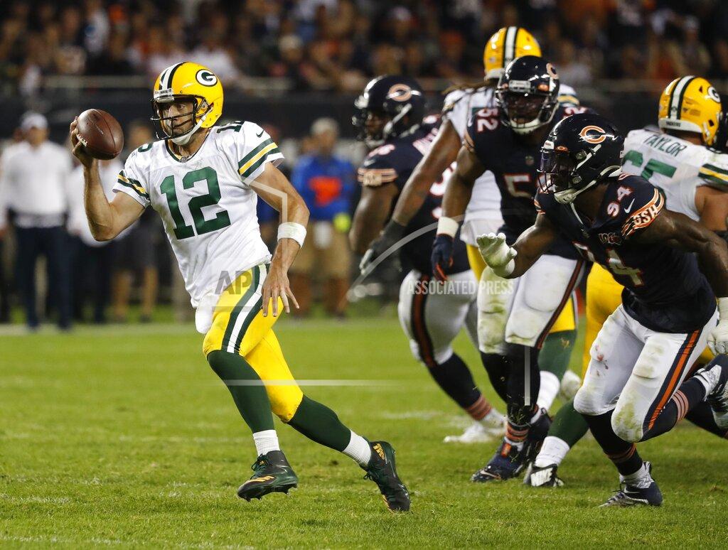 Charles Rex Arbogast Green Bay Packers' Aaron Rodgers runs during the second half of an NFL football game against the Chicago Bears Thursday, Sept. 5, 2019, in Chicago. (AP Photo/Charles Rex Arbogast)