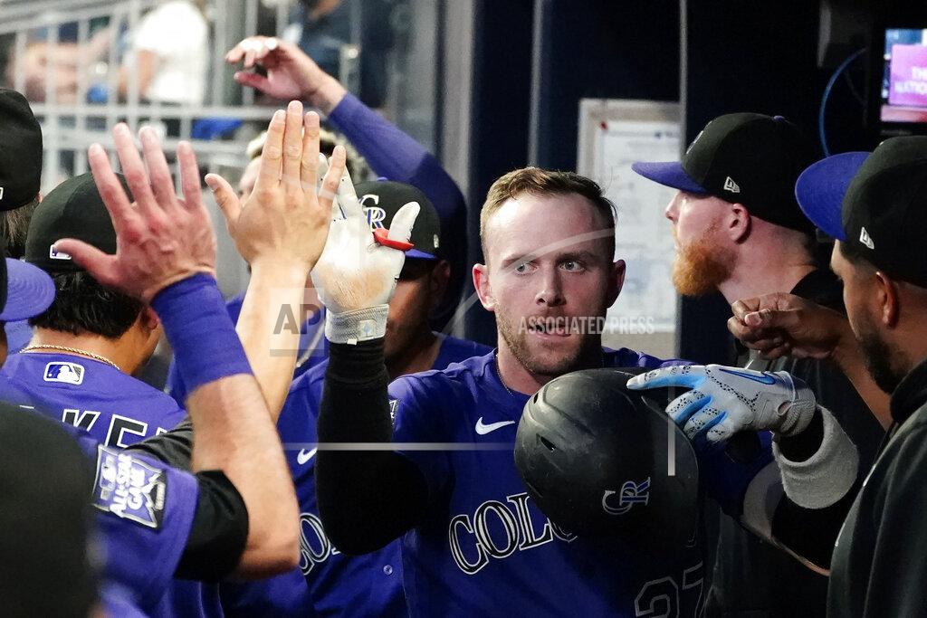 John Bazemore Colorado Rockies shortstop Trevor Story celebrates in the dugout after hitting a solo home run in the first inning of a baseball game against the Atlanta Braves Tuesday, Sept. 14, 2021, in Atlanta. (AP Photo/John Bazemore)