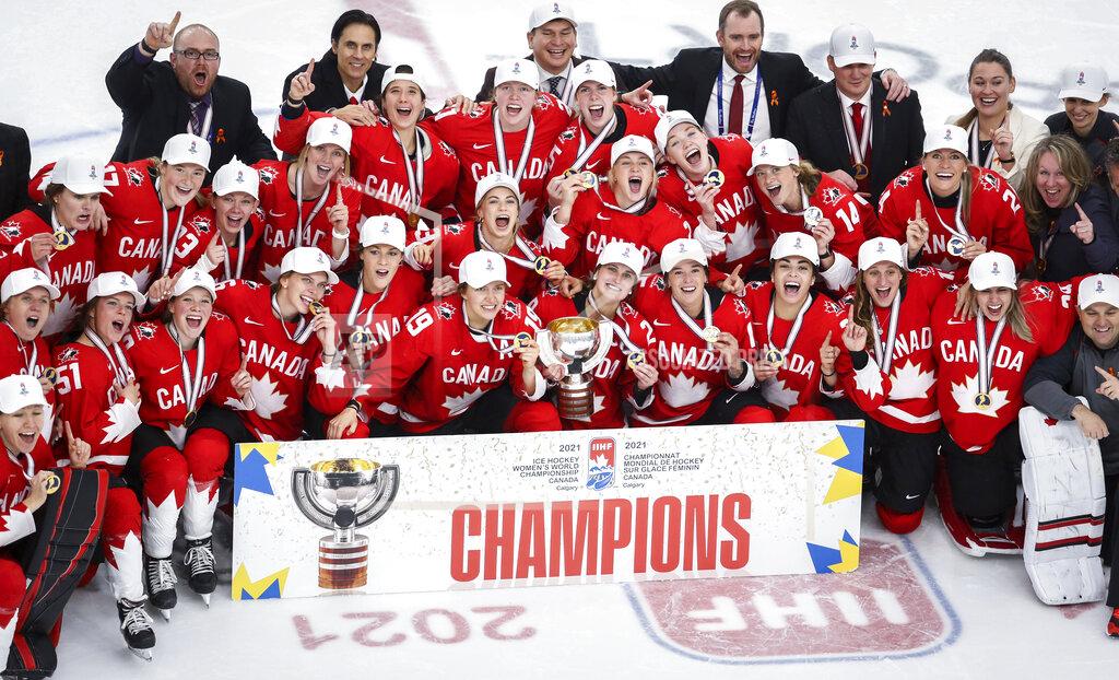 Jeff Mcintosh FILE - Canada celebrates defeating the United States in overtime in the IIHF hockey women's world championships title game in Calgary, Alberta, Tuesday, Aug. 31, 2021. The United States is the defending Olympic champion after beating Canada in an exceptionally nail-biting 3-2 shootout win at South Korea in 2018 to end Canada's run of four gold medals. And yet, Canada is the reigning world champion after punching back with a 3-2 overtime gold-medal win in Calgary, Alberta, in August to end USA's run of five consecutive titles.(Jeff McIntosh/The Canadian Press via AP, File)