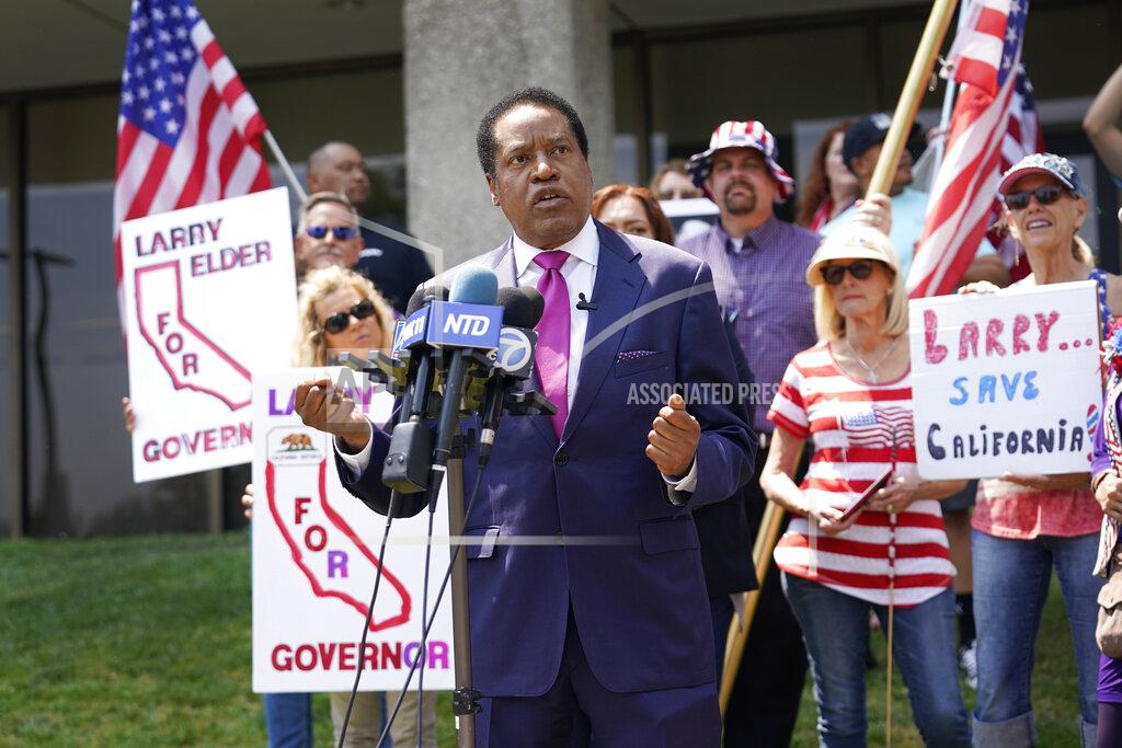 Marcio Jose Sanchez FILE — In this July 13, 2021 file photo radio talk show host Larry Elder speaks to supporters during a campaign stop in Norwalk, Calif. Elder has announced his candidacy for governor in the Sept. 14 recall election but the California Secretary of State's office has rejected his candidacy saying Elder, a Republican, filed incomplete tax returns that are required to run. Elder is challenging the decision. (AP Photo/Marcio Jose Sanchez, File)