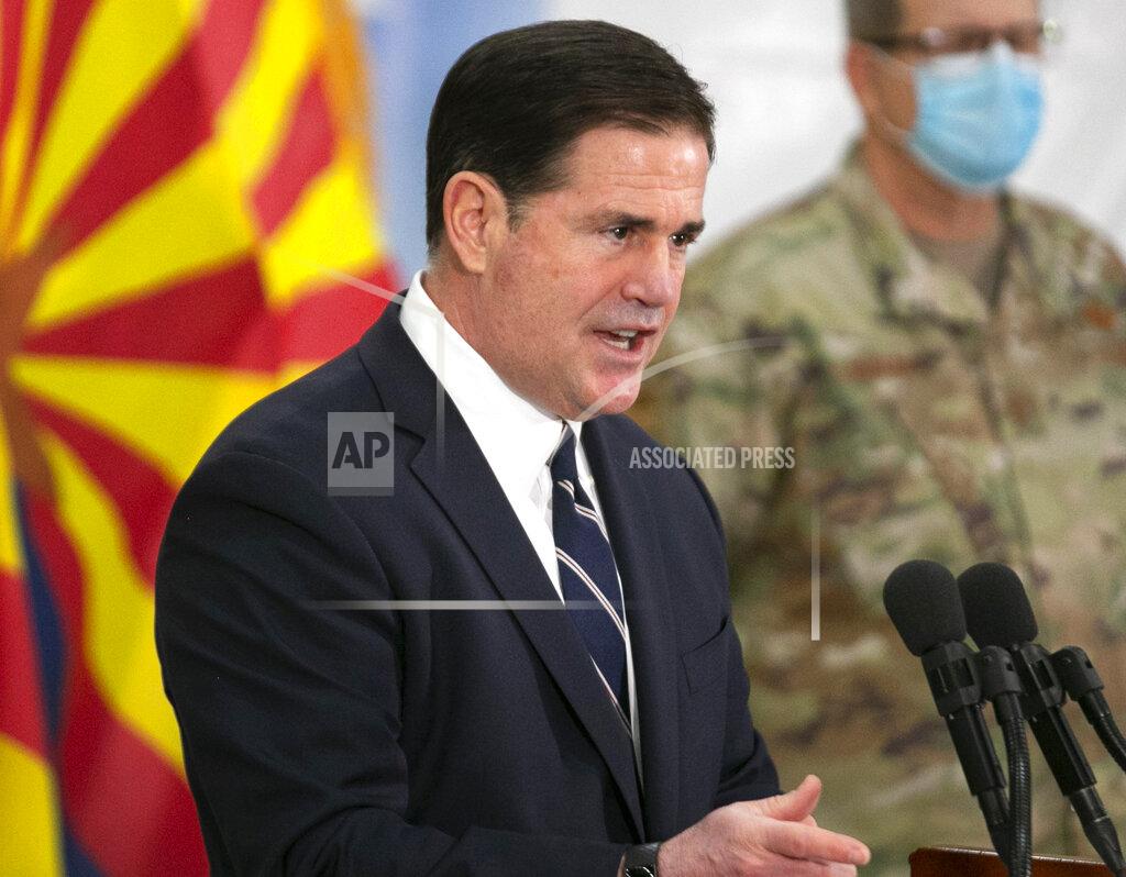David Wallace FILE - In this Dec. 16, 2020, file photo Arizona Republican Gov. Doug Ducey speaks during a press conference in Phoenix. Ducey has lifted capacity restrictions at gyms, restaurants, and other businesses. Ducey cited lower COVID-19 cases and increased vaccination as he eases up on the pandemic restrictions that have upended life for nearly a year. Ducey announced the changes Friday, March 5, 2021, citing declining COVID-19 cases and the rollout of the vaccine. (David Wallace/The Arizona Republic via AP, File)