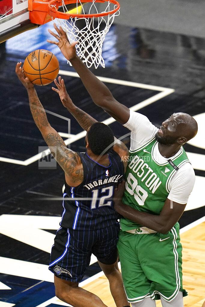 John Raoux Boston Celtics center Tacko Fall (99) blocks a shot attempt by Orlando Magic guar Sindarius Thornwell (12) during the second half of an NBA basketball game, Wednesday, May 5, 2021, in Orlando, Fla. (AP Photo/John Raoux)