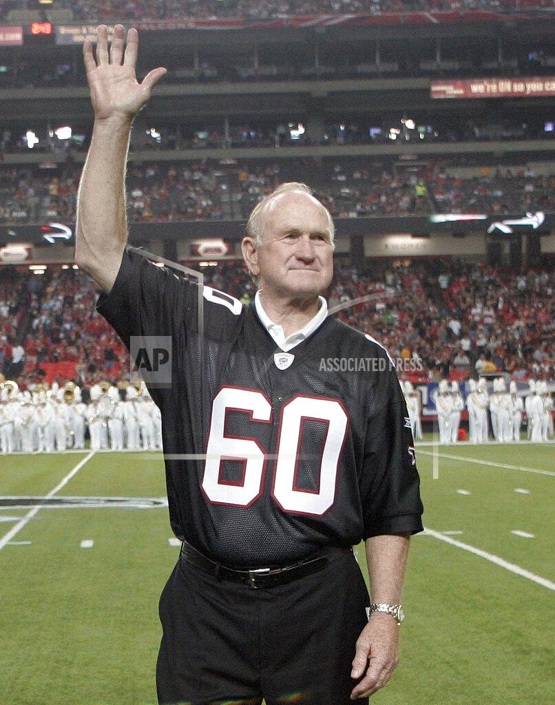 John Amis FILE - In this Sept. 20, 2009, file photo, former Atlanta Falcons Pro Bowler Tommy Nobis is introduced along with other members of the 1966 inaugural team during halftime of an NFL football game against the Carolina Panthers in Atlanta. Nobis, a hard-hitting linebacker for Atlanta and the University of Texas who earned the nickname "Mr. Falcon," had the most severe form of chronic traumatic encephalopathy. And now, as Atlanta prepares to host the Super Bowl, the descent of the NFL upon their hometown is a reminder for his family of the impact, both good and bad, that football has had on them. (AP Photo/John Amis, File)