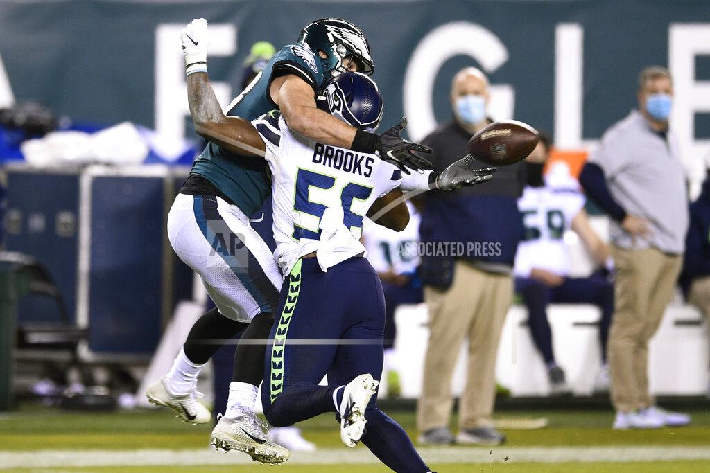 Derik Hamilton Philadelphia Eagles' Dallas Goedert, left, cannot catch a pass against Seattle Seahawks' Jordyn Brooks during the second half of an NFL football game, Monday, Nov. 30, 2020, in Philadelphia. Brooks was penalized for pass interference on the play. (AP Photo/Derik Hamilton)