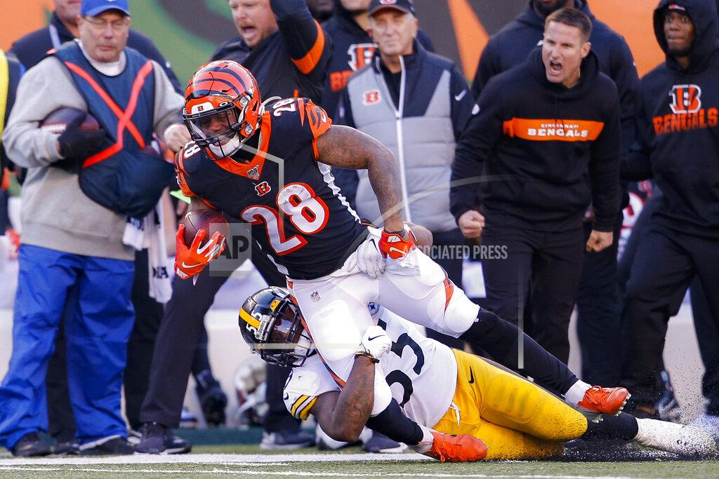Gary Landers Cincinnati Bengals running back Joe Mixon (28) is tackled on the run by Pittsburgh Steelers linebacker Devin Bush (55) during the second half an NFL football game, Sunday, Nov. 24, 2019, in Cincinnati. (AP Photo/Gary Landers)