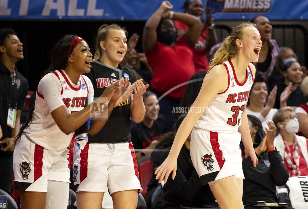 Ben Mckeown North Carolina State's Jada Boyd, left, Sophie Hart, middle, and Elissa Cunane (33) react to a play during the second half of a college basketball game against Longwood in the first round of the NCAA tournament in Raleigh, N.C., Saturday, March 19, 2022. (AP Photo/Ben McKeown)