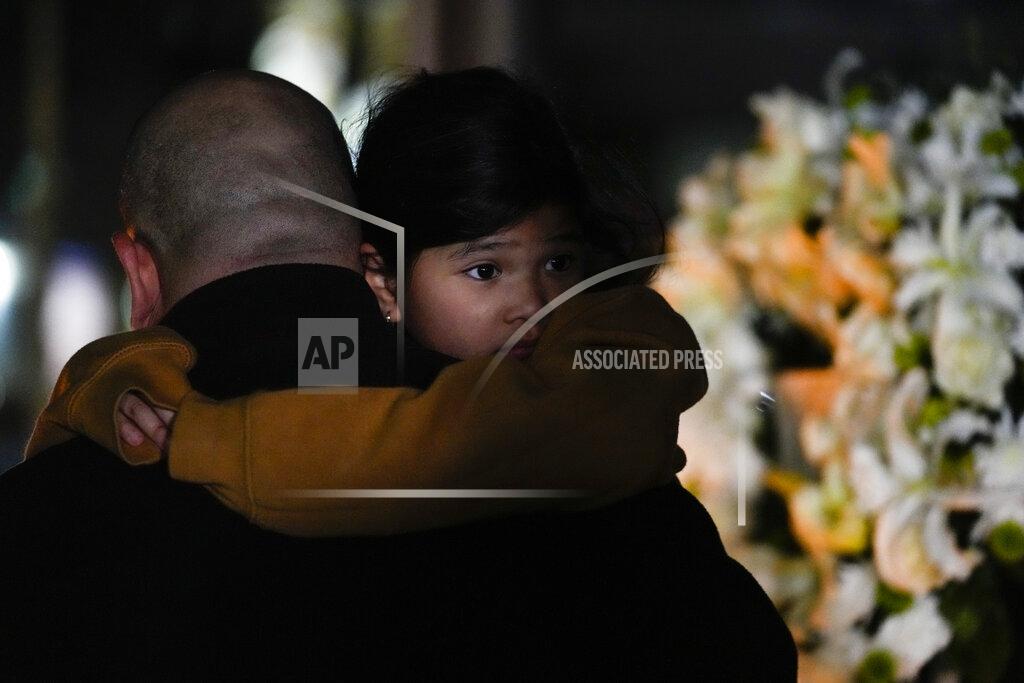 Ashley Landis People gather for a vigil honoring the victims of a shooting several days earlier at Star Ballroom Dance Studio, Monday, Jan. 23, 2023, in Monterey Park, Calif. A gunman killed multiple people late Saturday amid Lunar New Year's celebrations in the predominantly Asian American community. (AP Photo/Ashley Landis)
