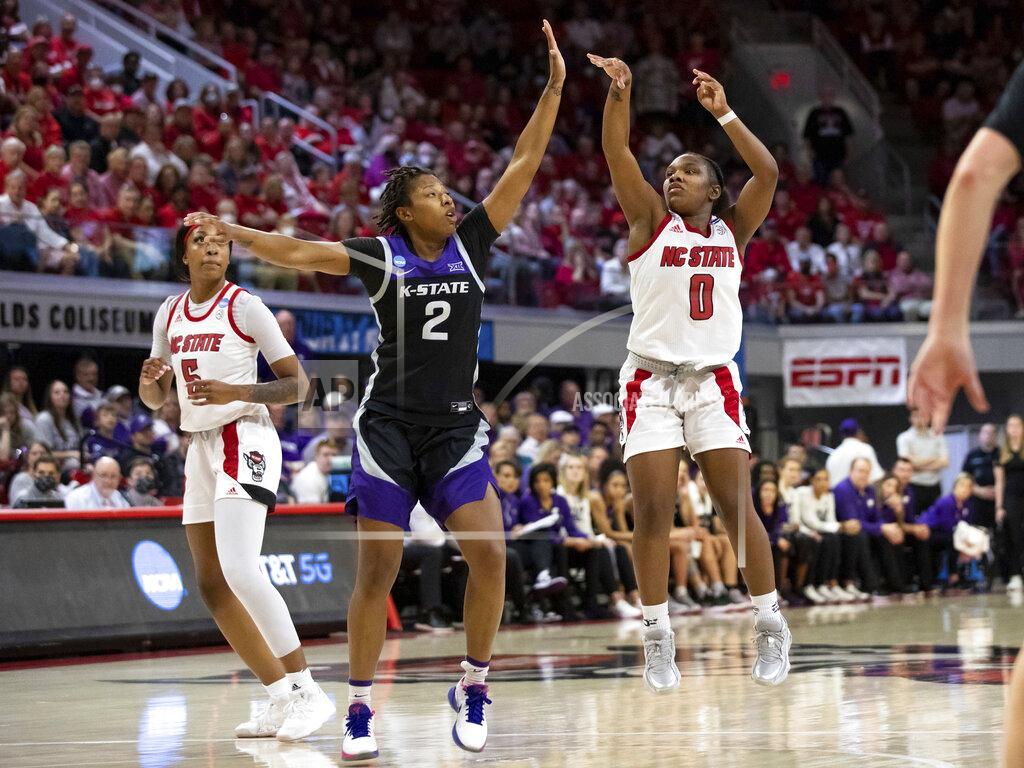 Ben Mckeown North Carolina State's Diamond Johnson (0) attempts to shoot over Kansas State's Cymone Goodrich (2) during the second half of a college basketball game in the second round of the NCAA tournament in Raleigh, N.C., Monday, March 21, 2022. (AP Photo/Ben McKeown)
