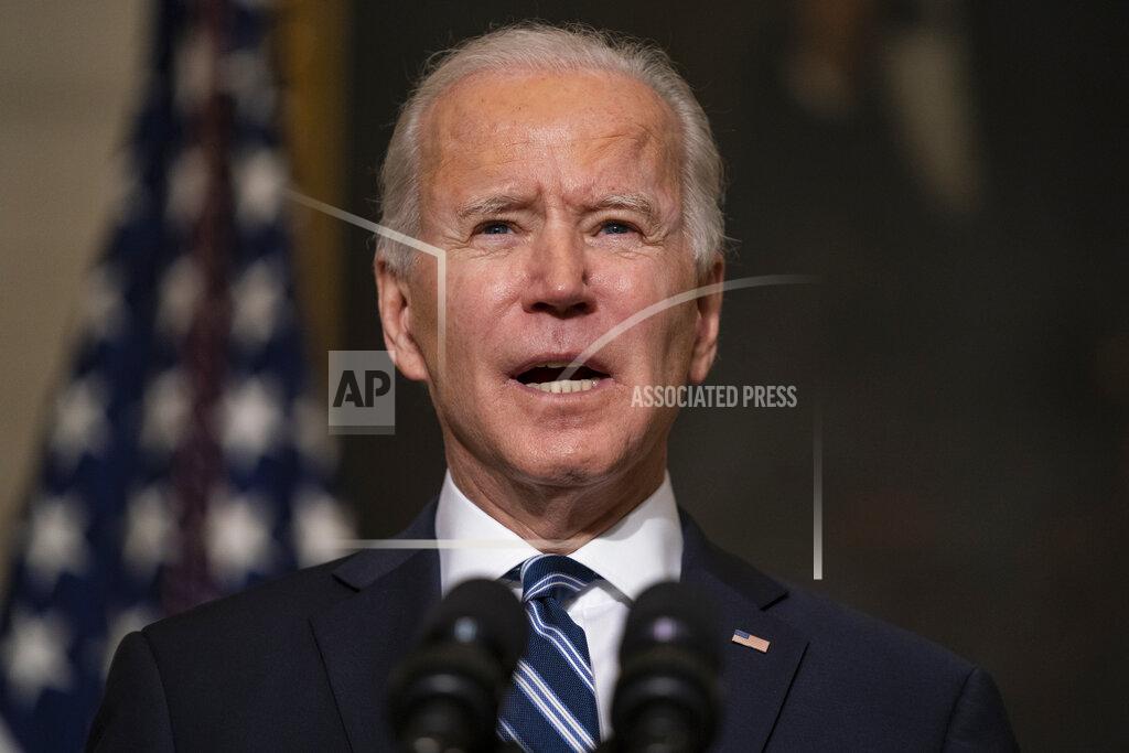 Evan Vucci FILE - In this Jan. 27, 2021, file photo President Joe Biden delivers remarks on climate change and green jobs, in the State Dining Room of the White House in Washington. When Biden convenes a virtual climate summit on Thursday, he faces a vexing task: how to put forward a nonbinding but symbolic goal to reduce greenhouse gas emissions that will have a tangible impact not only on climate change efforts in the U.S. but throughout the world.(AP Photo/Evan Vucci, File)