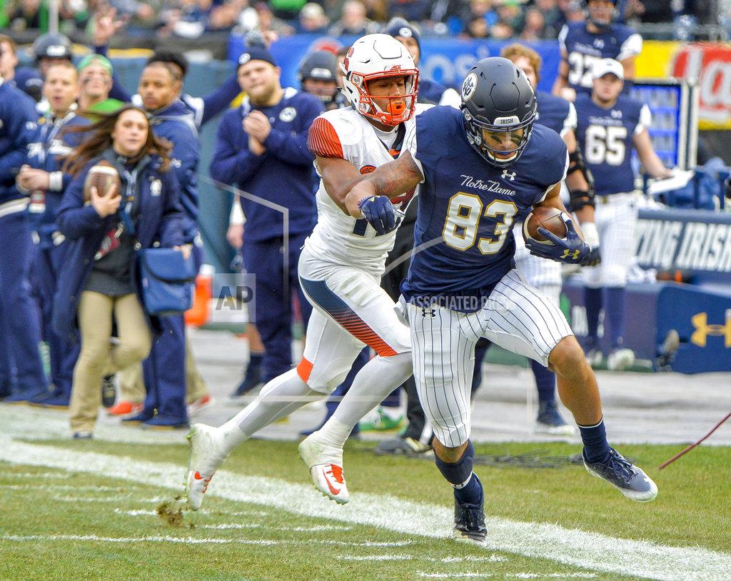 Howard Simmons Notre Dame wide receiver Chase Claypool (83) is pushed out-of-bounds by Syracuse defensive back Andre Cisco (19) during the first half of an NCAA college football game, Saturday, Nov. 17, 2018, at Yankee Stadium in New York. (AP Photo/Howard Simmons)