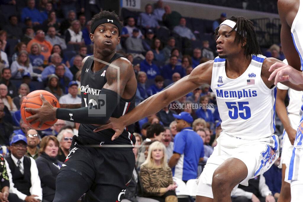 Karen Pulfer Focht Memphis' forward Precious Achiuwa (55) defends Cincinnati's forward Tre Scott (13) in the first half of an NCAA college basketball game Thursday, Jan. 16, 2020, in Memphis, Tenn. (AP Photo/Karen Pulfer Focht)