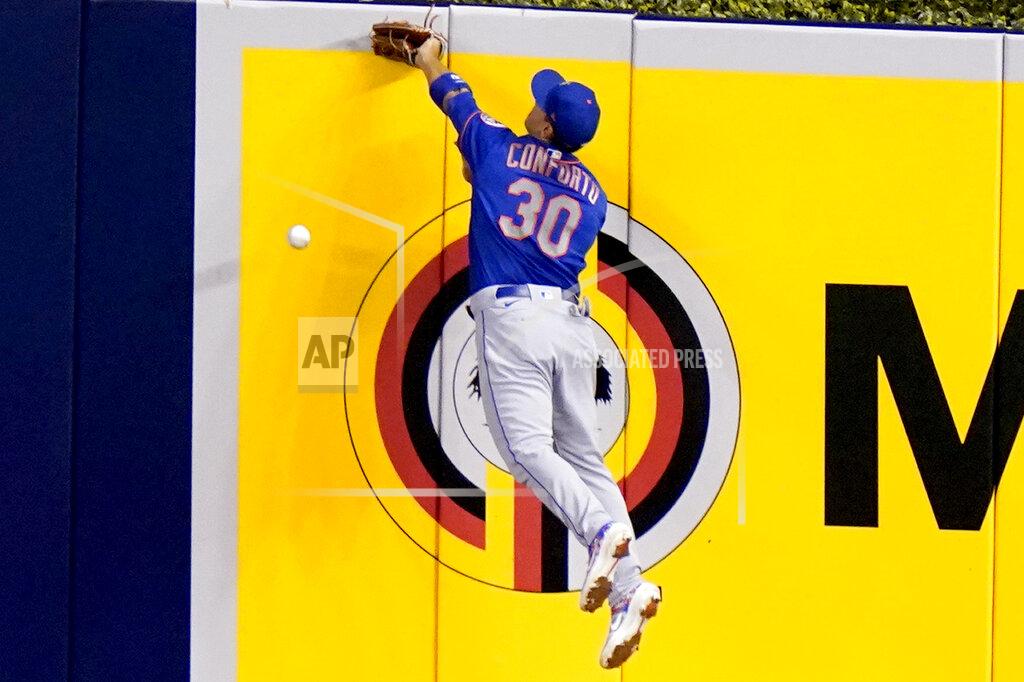 Lynne Sladky New York Mets right fielder Michael Conforto (30) can't get to a double hit by Miami Marlins' Matt Joyce during the fourth inning of a baseball game, Tuesday, Aug. 18, 2020, in Miami. (AP Photo/Lynne Sladky)