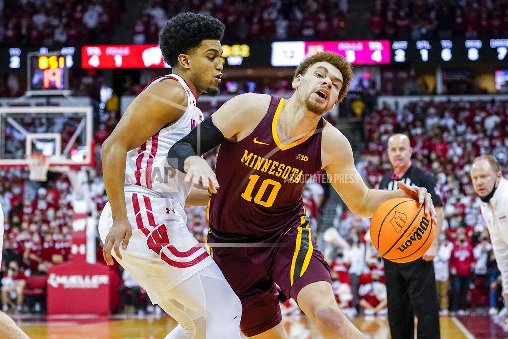 Andy Manis Minnesota's Jamison Battle (10) drives against Wisconsin's Chucky Hepburn (23) during the first half of an NCAA college basketball game Sunday, Jan. 30, 2022, in Madison, Wis. (AP Photo/Andy Manis)